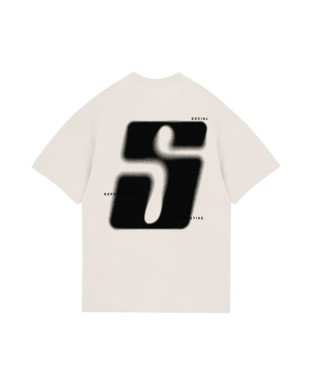 Bright white T-shirt featuring a bold, black, blurred graphic design with the words "Social," "Seducive," and "Sophisticated" stylishly scattered around the graphic, emphasizing modern streetwear fashion.