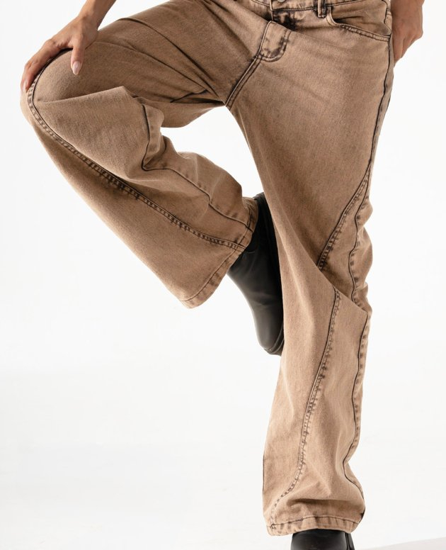 Comfy wide-leg brown jeans with black boots for casual fashion styling.