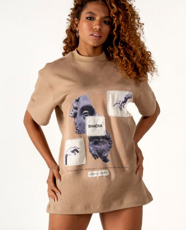 Unique women's casual beige T-shirt dress with artistic graphic print and embroidered patches, featuring the brand name "Shacra" for stylish streetwear fashion.