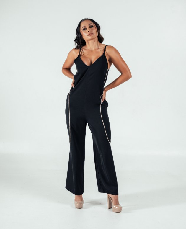 Black satin jumpsuit with gold piping, spaghetti straps, and wide-leg design perfect for stylish evening wear.